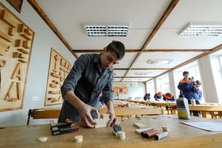 MINSK, BELARUS - 18 FEBRUARY, 2022: young people study in the college of the working professionのeditorial素材