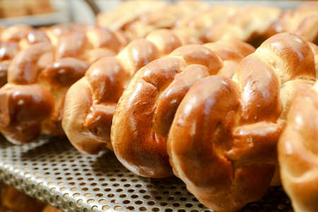 MINSK, BELARUS - 22 July, 2022: baker bakes bread at the bakeryの写真素材