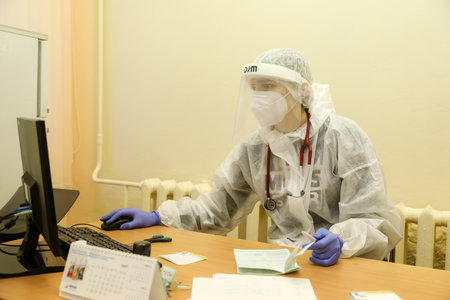 MINSK, BELARUS - 9 SEPTEMBER, 2022: doctor takes a patient in the hospitalの写真素材