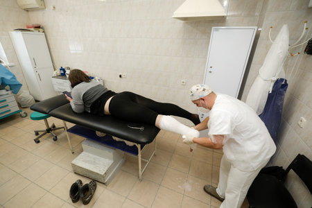 MINSK, BELARUS - 9 SEPTEMBER, 2022: traumatology department of the hospital bandaging of broken limbsの写真素材
