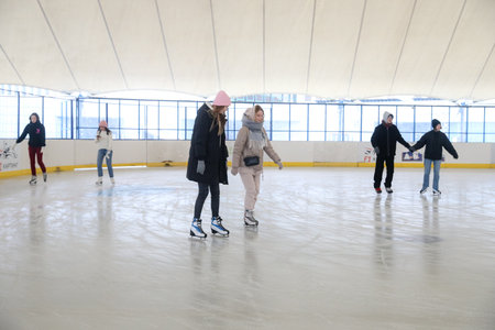 MINSK, BELARUS - 9 SEPTEMBER, 2022: people skating on the rinkの写真素材