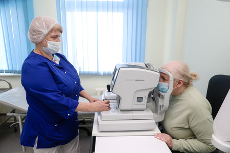 MINSK, BELARUS - 9 SEPTEMBER, 2022: doctor takes a patient in the hospitalの写真素材