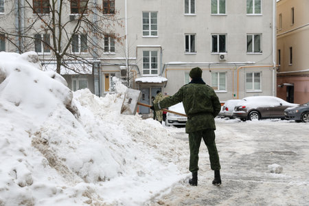 MINSK, BELARUS - 9 SEPTEMBER, 2022: soldiers clean the snowの写真素材