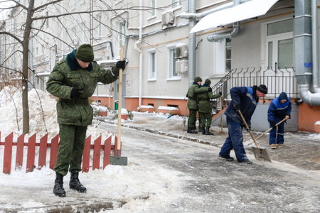 MINSK, BELARUS - 9 SEPTEMBER, 2022: soldiers clean the snowの写真素材