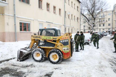 MINSK, BELARUS - 9 SEPTEMBER, 2022: soldiers clean the snowの写真素材