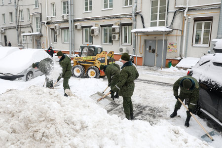 MINSK, BELARUS - 9 SEPTEMBER, 2022: soldiers clean the snowの写真素材