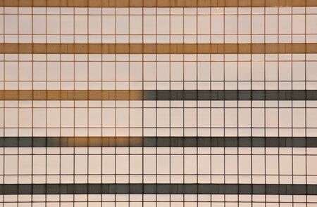 glass wall with a thin layer of gold of a high-rise building in Torontoの写真素材