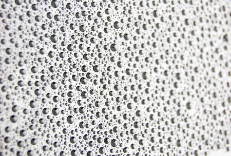 Gray rain drops on a car windowの写真素材