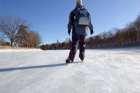 Skaters on ice of Rideau Canal, Ottawa.