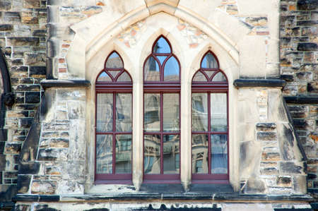 Reflection in glass of window of old building
