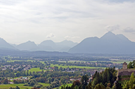 Houses in Alps landscape on green grass lawn.の写真素材