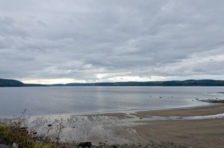 Saguenay river under dark clouds.の写真素材