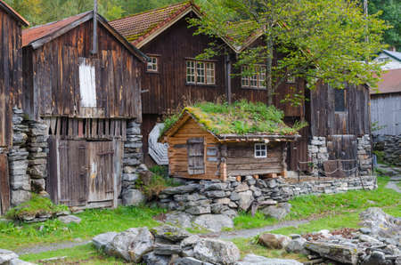 Small wooden cabin on the shore of Geiranger harbor, Norwayの写真素材