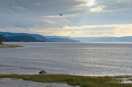 Saguenay river under dark clouds.の写真素材