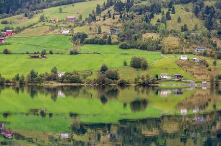 Reflection in Norway fjord at fall timeの写真素材