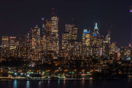Skyline of Toronto over Ontario Lake at the night time.の写真素材