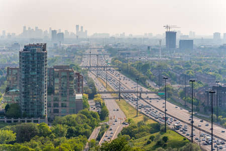 A view of the condominiums and highway on the shore of Lake Ontario in Toronto, Canada.の写真素材