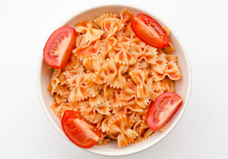 Pasta and tomato sauce in white circle shape bowlの写真素材
