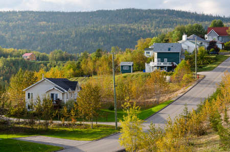 A small road going uphill in town Tadoussac, Quebecの写真素材