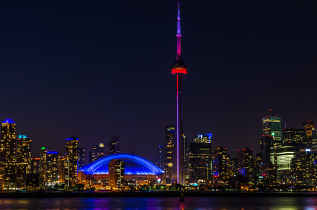 Skyline of Toronto over Ontario Lake after sunsetのeditorial素材