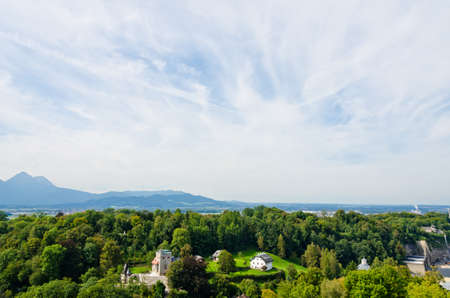 Houses in Alps landscape on green grass lawn.の写真素材