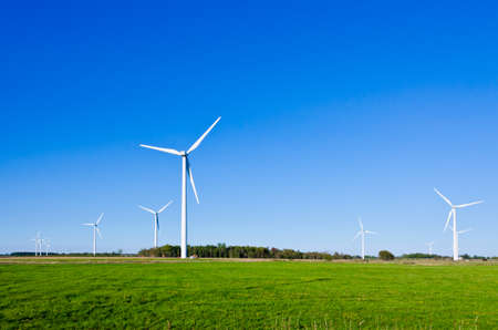 Wind turbine on green grass backgroundの写真素材