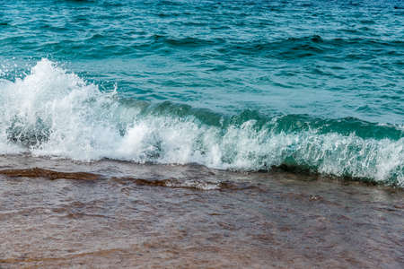 Surf on pebble beach of Superior Lake, Canada