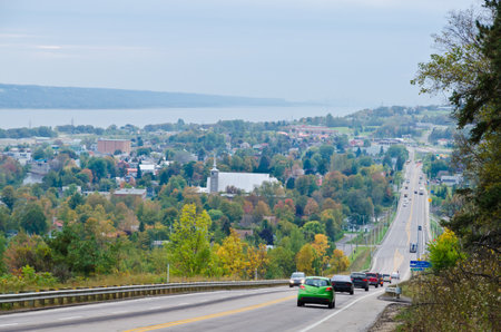 Autumn endless road under cloudscape, Quebec, Canadaのeditorial素材