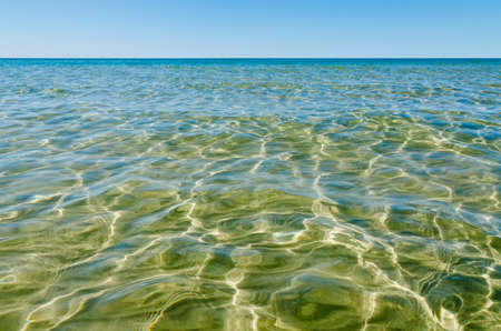 Light, shadow and clear water at shore of Georgian Bay Ontarioの写真素材