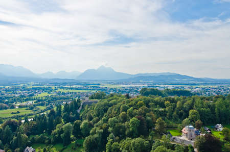 Houses in Alps landscape on green grass lawn.の写真素材