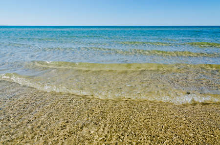 Light, shadow and clear water at shore of Georgian Bay Ontarioの写真素材