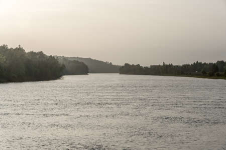 River water in backlit in summer evening.の写真素材
