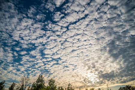 White fluffy clouds in the blue sky. Canada