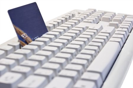 Credit card on a computer keyboardの写真素材