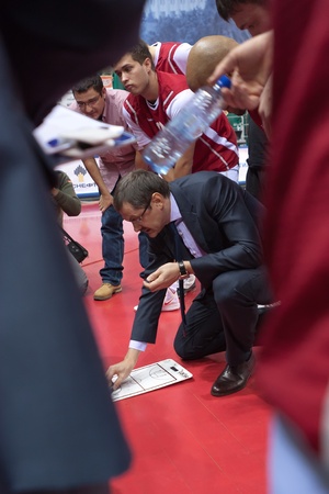 SAMARA, RUSSIA - NOVEMBER 25: Time out. Coach of BC Krasnye Krylia Bazarevich Sergey says the game plan against BC Spartak on November 25, 2011 in Samara, Russia.のeditorial素材