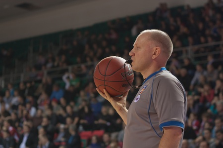 SAMARA, RUSSIA - NOVEMBER 02: Referee of the game Sergey Krug with ball during BC Krasnye Krylia and BC Lokomotiv-Kuban game on November 02, 2011 in Samara, Russia.のeditorial素材