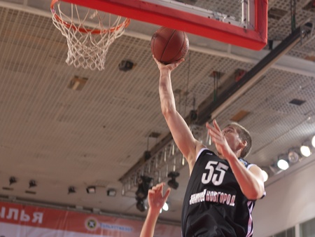 SAMARA, RUSSIA - MARCH 03: Golovin Dmitriy of BC Nizhniy Novgorod with ball attacks a basket of BC Krasnye Krylia on March 03, 2012 in Samara, Russia.のeditorial素材