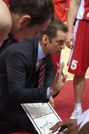SAMARA, RUSSIA - FEBRUARY 06: Time out. Coach of BC Spartak-Primorye Gundars Vetra says the game plan against BC Krasnye Krylia on February 06, 2013 in Samara, Russia.のeditorial素材