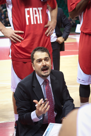 SAMARA, RUSSIA - FEBRUARY 26: Time out. Coach of BC TOFAS SC BURSA Ahmet Caki says the game plan against BC Krasnye Krylia on February 26, 2013 in Samara, Russia.のeditorial素材