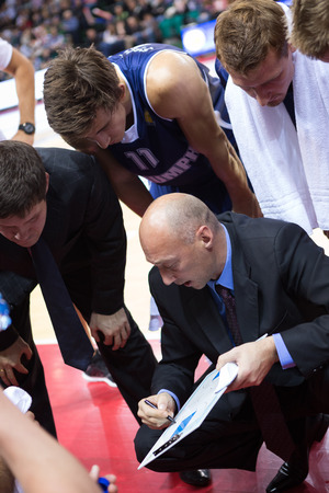 SAMARA, RUSSIA - OCTOBER 22: Timeout. Head coach of BC Triumph Vasiliy Karasev during a timeout of the game against BC Krasnye Krylia on October 22, 2013 in Samara, Russia.のeditorial素材