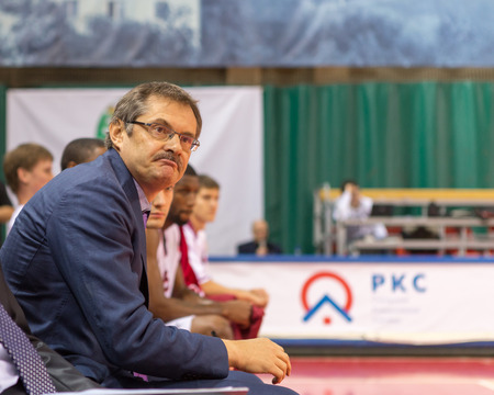 SAMARA, RUSSIA - DECEMBER 17: BC Krasnye Krylia head coach Sergey Bazarevich watches the game from the bench during the BC Atomeromu basketball game on December 17, 2013 in Samara, Russia.のeditorial素材