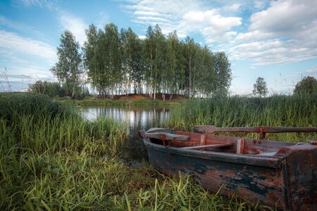 wooden boat on the riverの写真素材