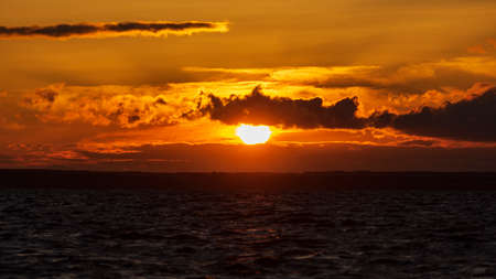 sunset in yellow and red tones over the Volgaの写真素材