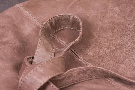 Belts knot on leather brown bagの写真素材