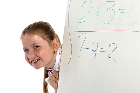 The cheerful schoolgirl looks from a board