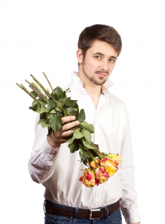 man with bouquet of red roses. Isolated on white.の写真素材