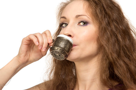 Young happy woman holding a coffee cupの写真素材