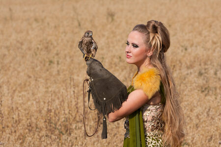Old style Woman with hawk on hand
