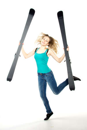 Girl holding ski in studio, isolatedの写真素材