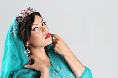 Adult arabian woman in green abaya